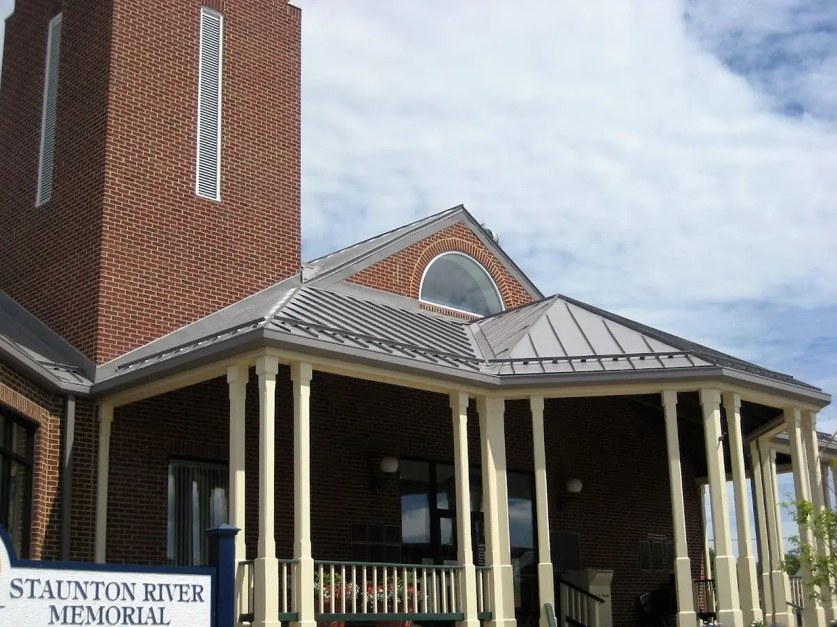 Skilled roofing craftsmen working on a residential roof in Rolesville